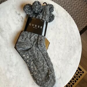 Guess TV/reading socks, cozy, green & white, with pom-poms.